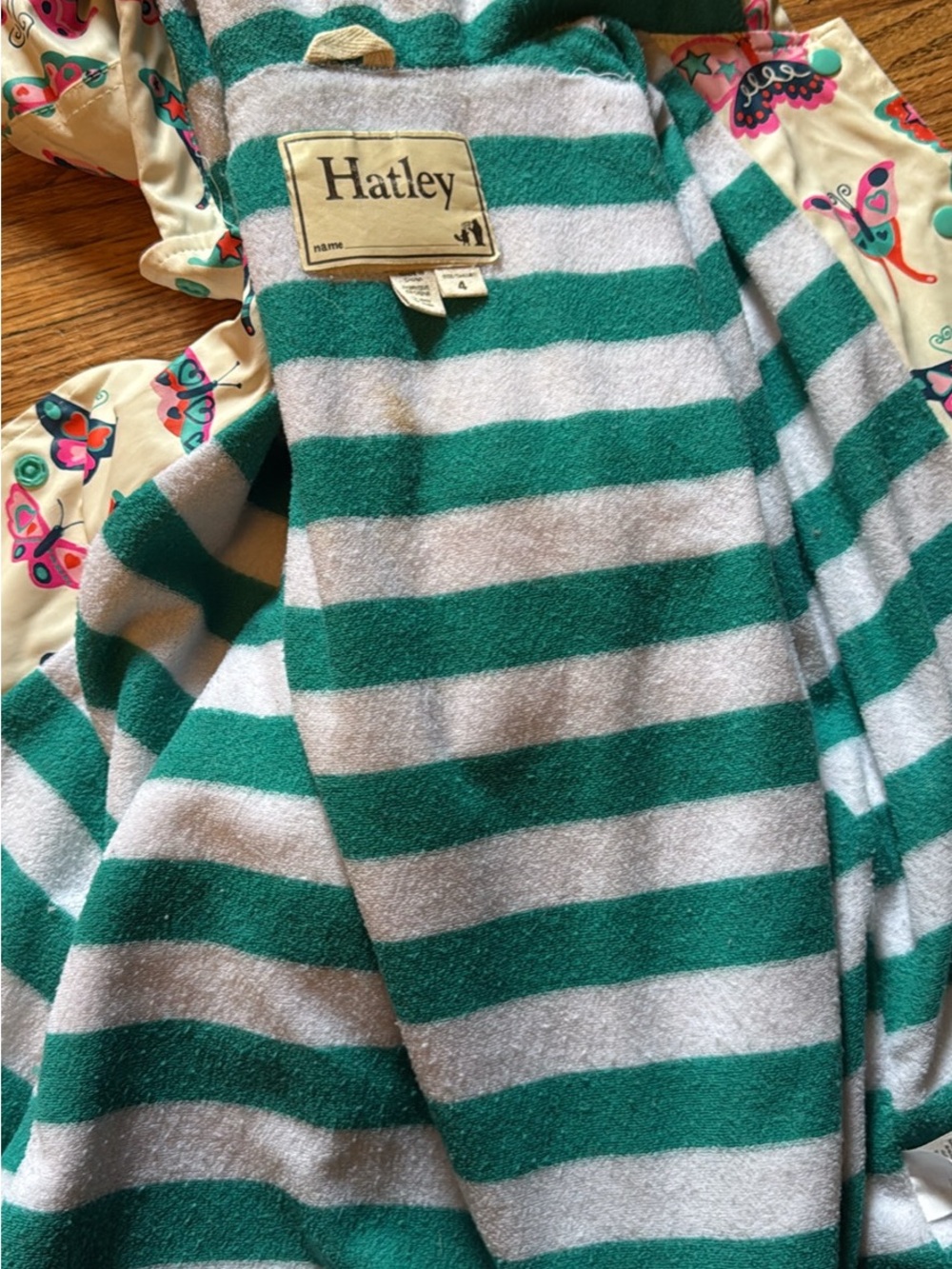Hatley Cream Raincoat with Pink, Teal & Purple Butterfly Print